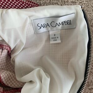 Red jacked dress fully lined with gold buttons on the sleeves